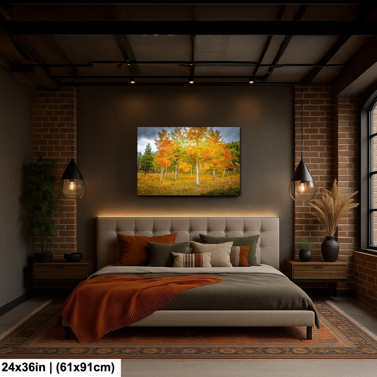 a serene bedroom with a large bed, a painting of a field with trees in autumn colors, and a brick wall.