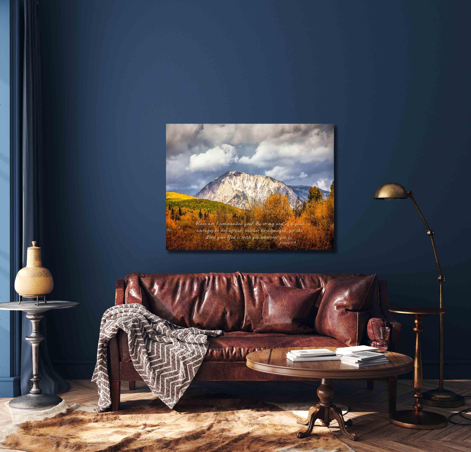 Beautiful snowy mountain peak rising above colorful fall aspens in Colorado. Scripture verse Joshua 1:9, Show in mockup version30x40 over leather couch.