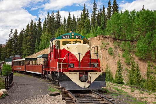 Train on railroad tracks in Colorado mountains near Leadville