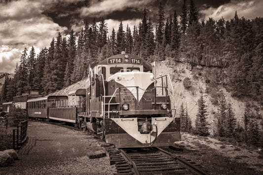 Old train on tracks in the mountains near Leadville Colorado. Photo in sepia tone. Also available in black and white print.