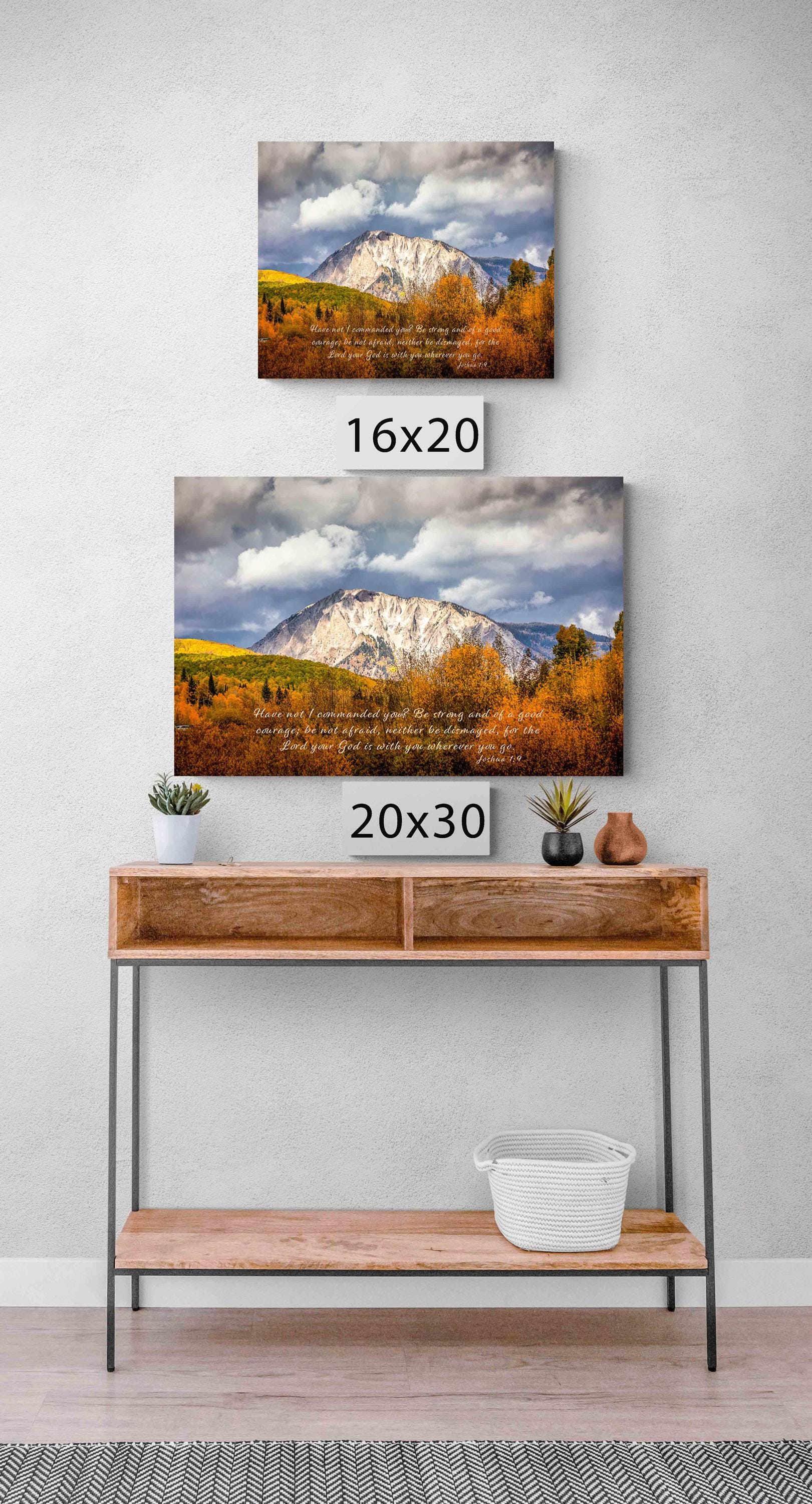 Beautiful snowy mountain peak rising above colorful fall aspens in Colorado. Scripture verse Joshua 1:9. Shown in mockup sizes 16x20 and 20x30