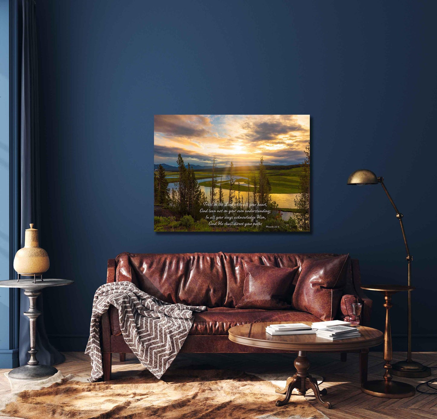 Proverbs 3:5-6 Scripture on sunrise photo. Taken in the Hayden Valley of Yellowstone National Park. Trust in the Lord with all of your heart. Shown in a living room mockup with navy wall and leather sofa.