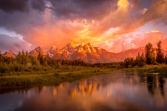 Grand Teton National park at sunrise. Beautiful vibrant sunrise with the sun glowing on the landscape. Fine art photography available in prints and canvases. Offered by the original photographer.